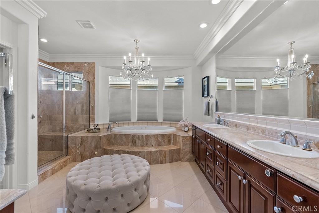 20366 Vía Galileo Porter Ranch, CA 91326 - Photo 69 of 75 a spacious bathroom with a tub sink and a mirror