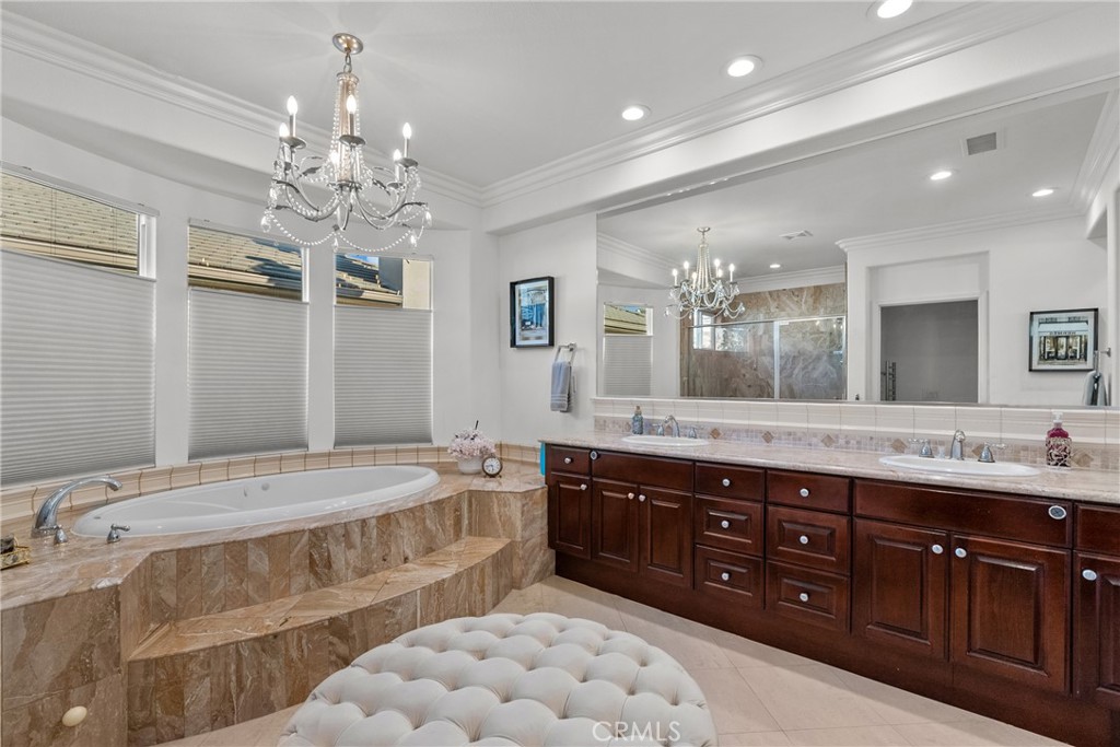 20366 Vía Galileo Porter Ranch, CA 91326 - Photo 71 of 75 a spacious bathroom with a granite countertop double vanity and a mirror