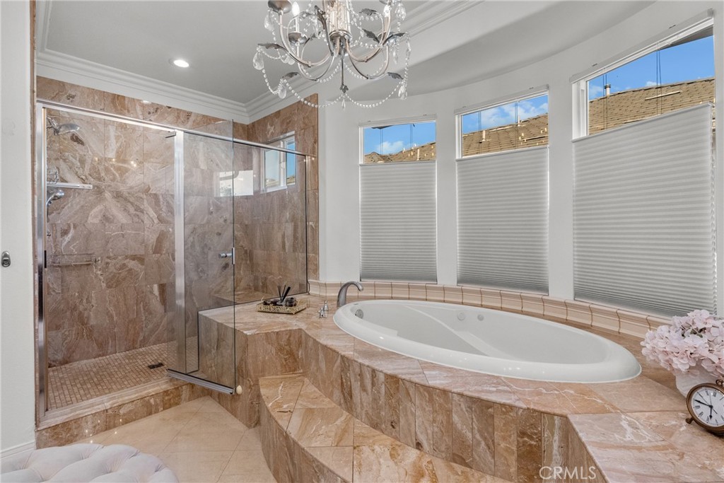 20366 Vía Galileo Porter Ranch, CA 91326 - Photo 72 of 75 a spacious bathroom with a bathtub and shower