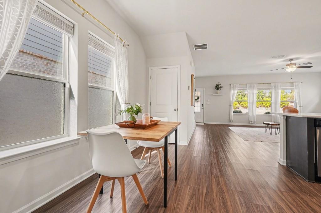 4740 Electric Avenue Southwest Mableton, GA 30126 - Photo 13 of 51 a view of a dining room with furniture and wooden floor