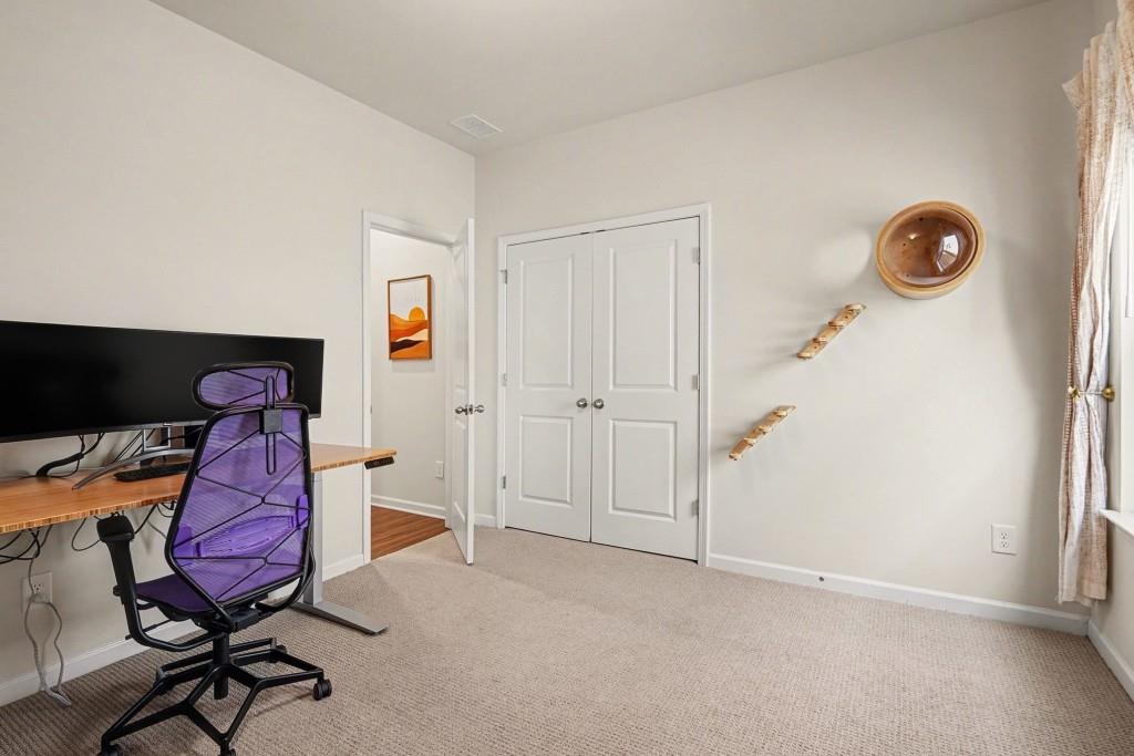 4740 Electric Avenue Southwest Mableton, GA 30126 - Photo 18 of 51 a view of a workspace with furniture and a window