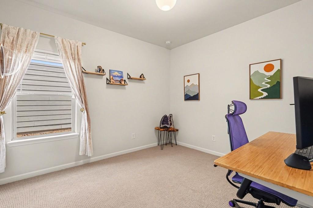 4740 Electric Avenue Southwest Mableton, GA 30126 - Photo 19 of 51 a view of room with guitars and wooden floor
