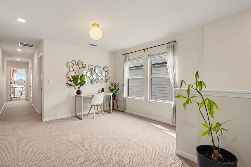 4740 Electric Avenue Southwest Mableton, GA 30126 - Photo 23 of 51 a living room with furniture and a potted plant