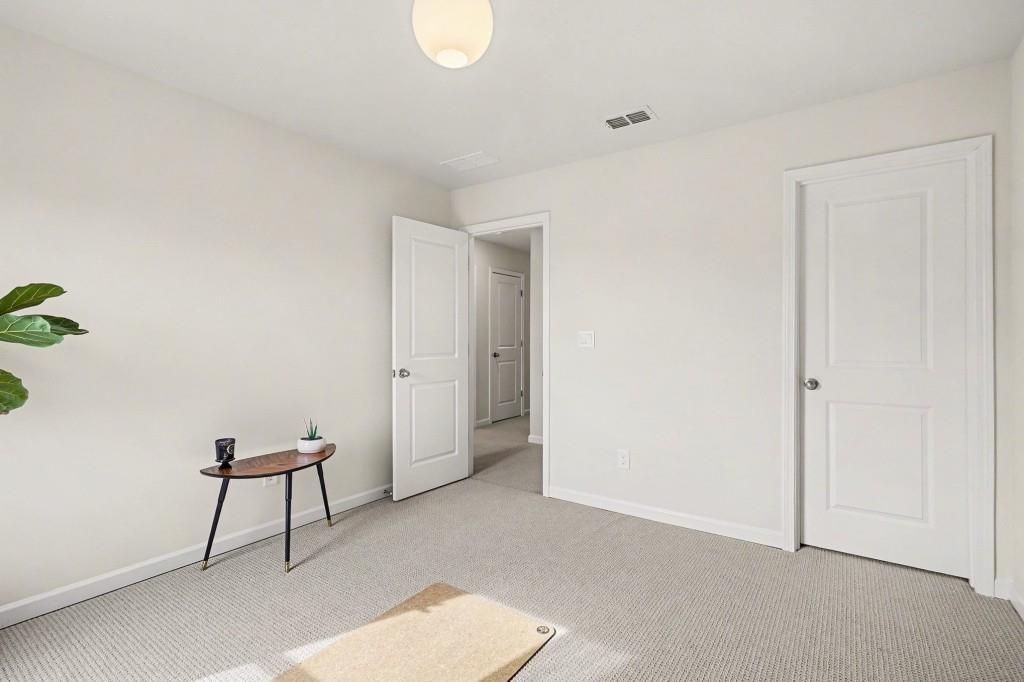 4740 Electric Avenue Southwest Mableton, GA 30126 - Photo 31 of 51 a view of a room with a bench and a potted plant