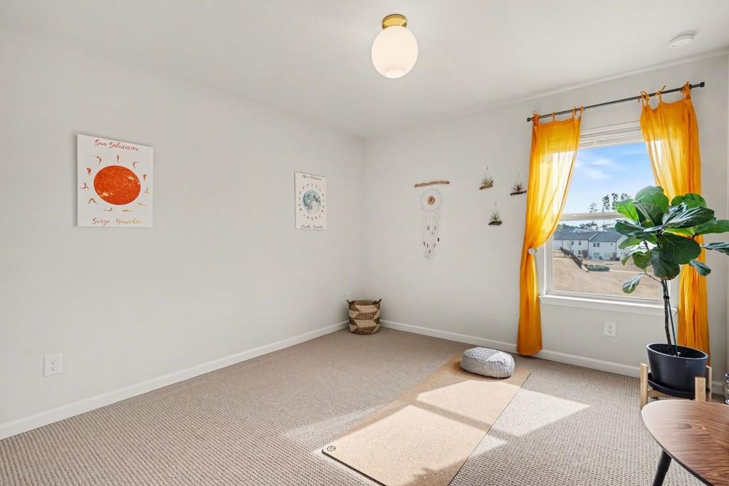 4740 Electric Avenue Southwest Mableton, GA 30126 - Photo 32 of 51 a view of room with window and a ceiling fan