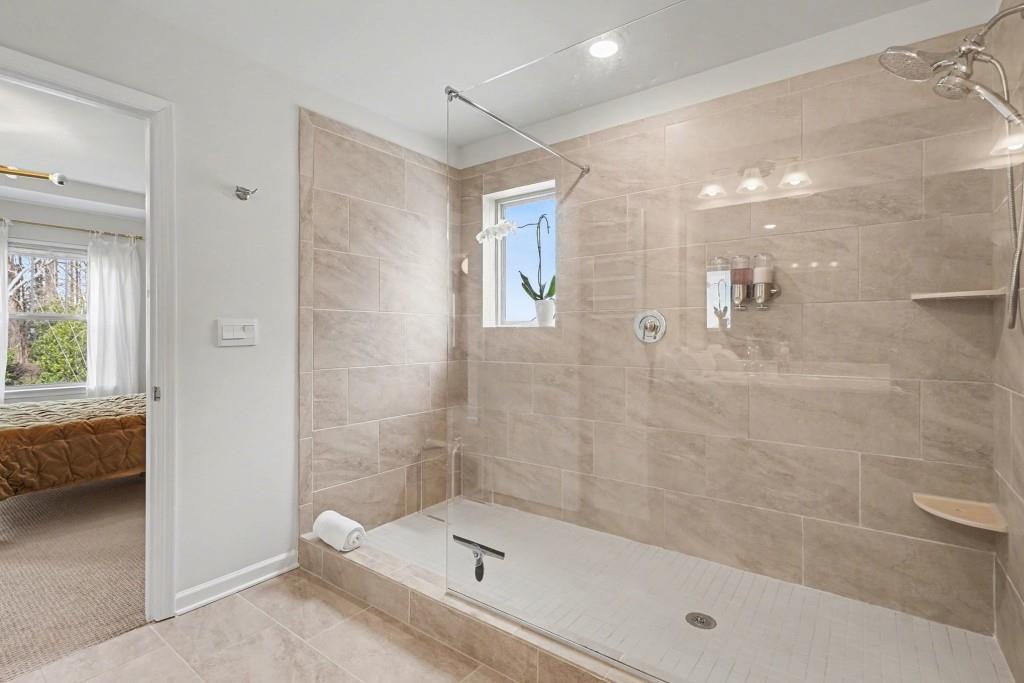 4740 Electric Avenue Southwest Mableton, GA 30126 - Photo 5 of 51 a bathroom with a shower and bathtub