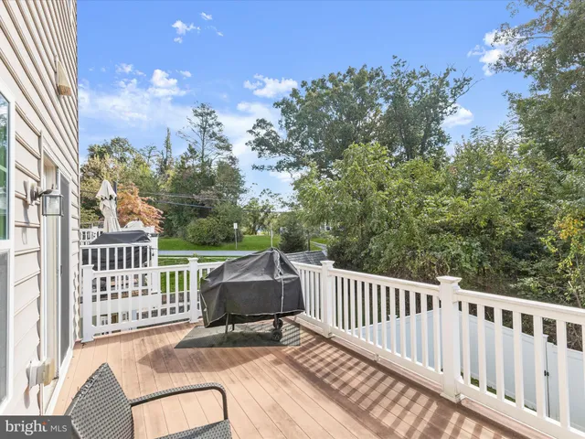 a view of a chair and tables in the balcony