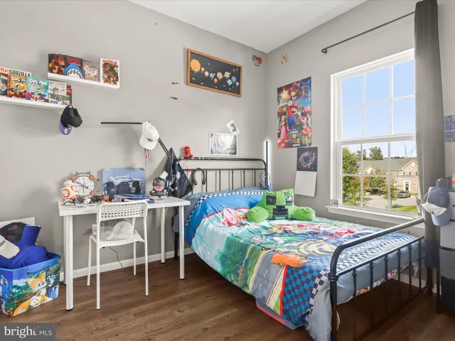 a bedroom with a bed and a table in it