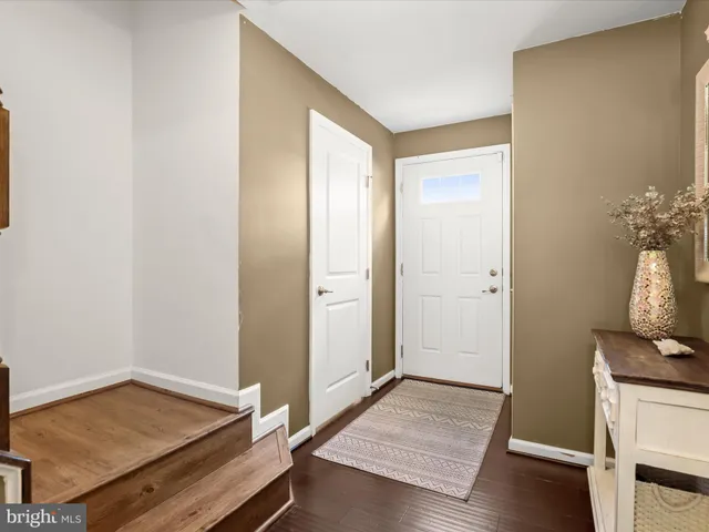 a view of an empty room and wooden floor
