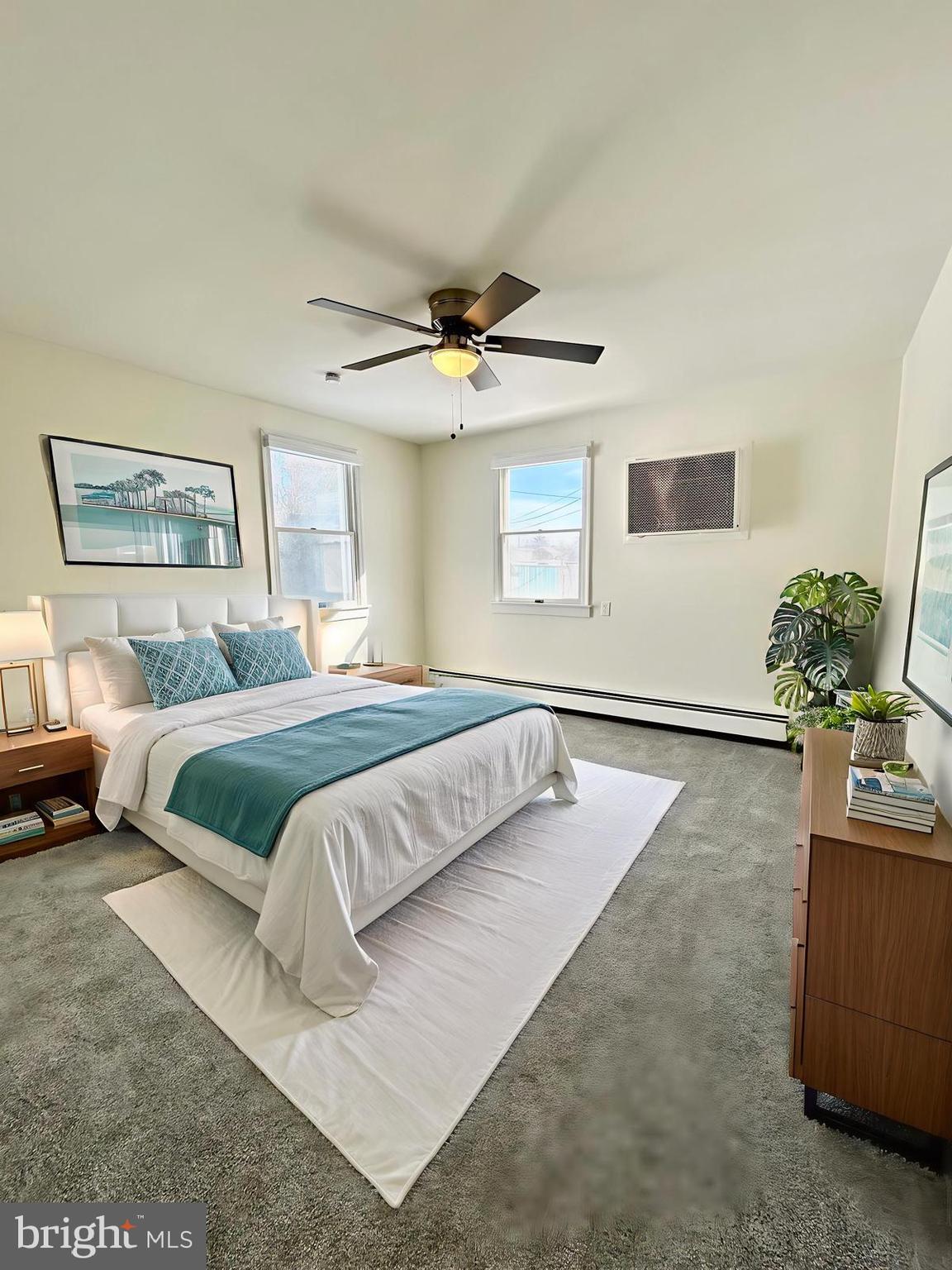 1007 Ripley Street Philadelphia, PA 19111 - Photo 14 of 39 a bedroom with a large bed and a chandelier