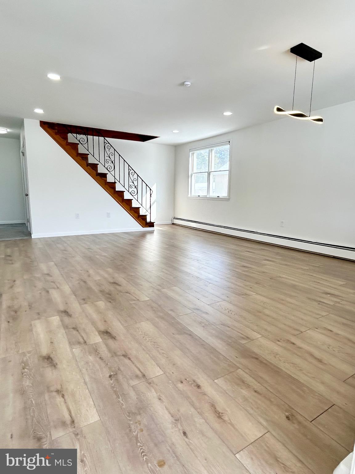 1007 Ripley Street Philadelphia, PA 19111 - Photo 3 of 39 a view of an empty room with wooden floor and a window