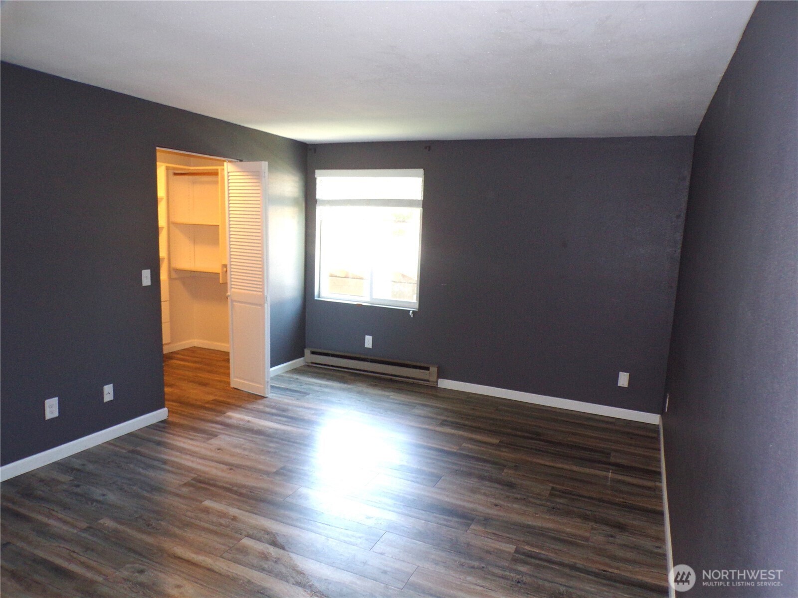 2020 Southwest 318th Place, Unit C3 Federal Way, WA 98023 - Photo 11 of 22 a view of an empty room with wooden floor and a window