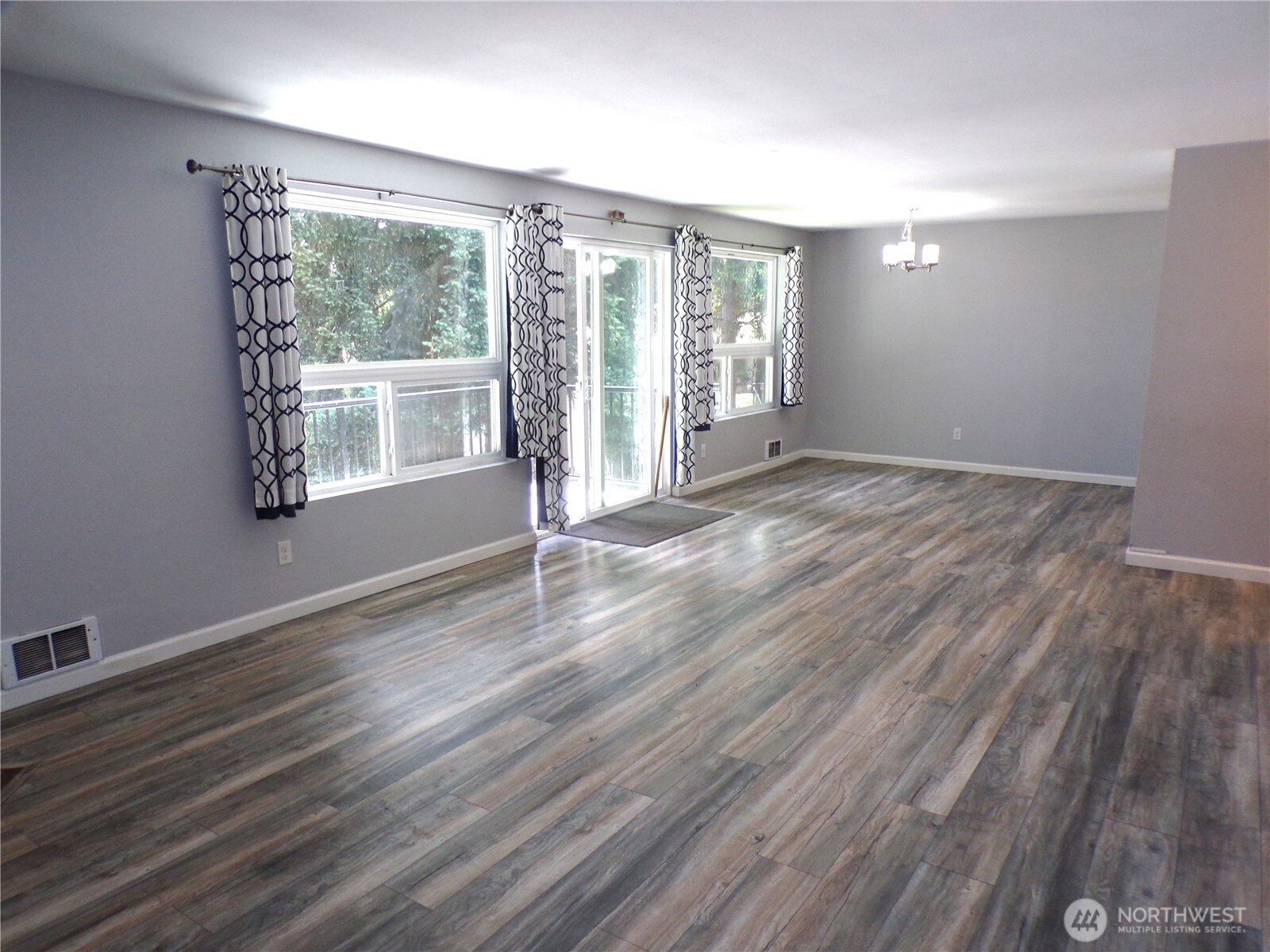 2020 Southwest 318th Place, Unit C3 Federal Way, WA 98023 - Photo 2 of 22 a view of an empty room with wooden floor and a window