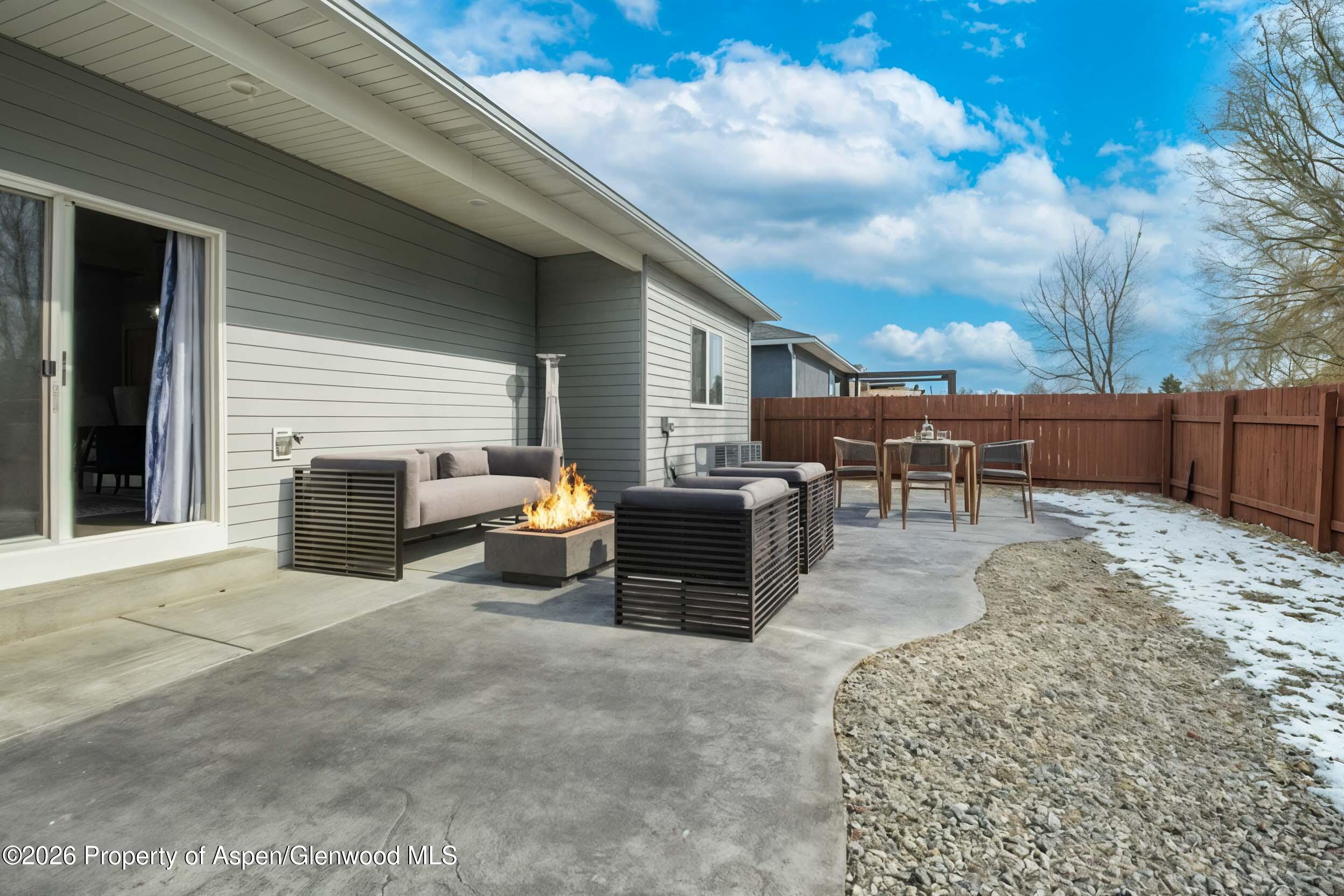 1671 East 17th Circle Rifle, CO 81650 - Photo 19 of 25 a view of a backyard with furniture