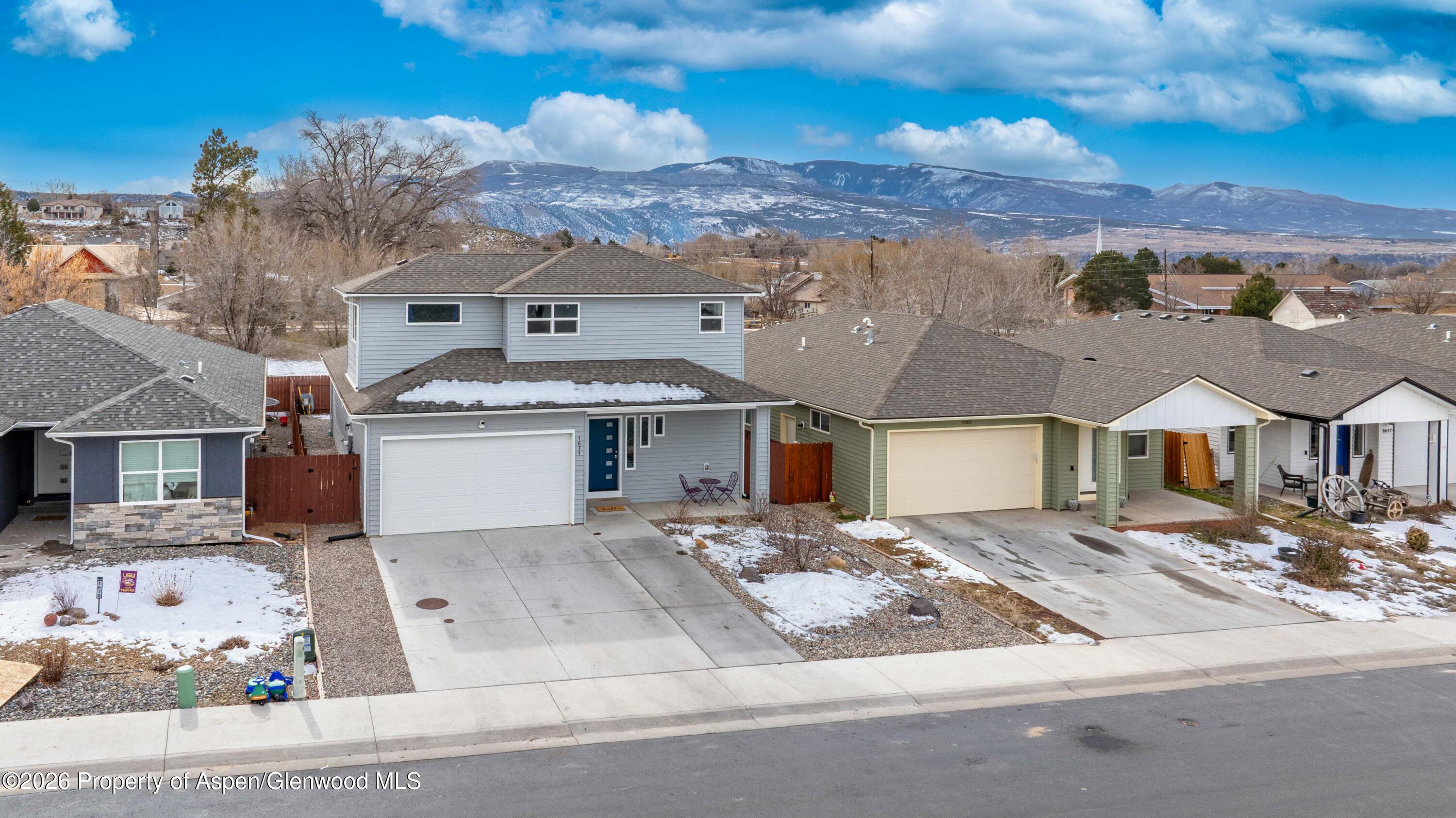 1671 East 17th Circle Rifle, CO 81650 - Photo 2 of 25 front view of a house with a street