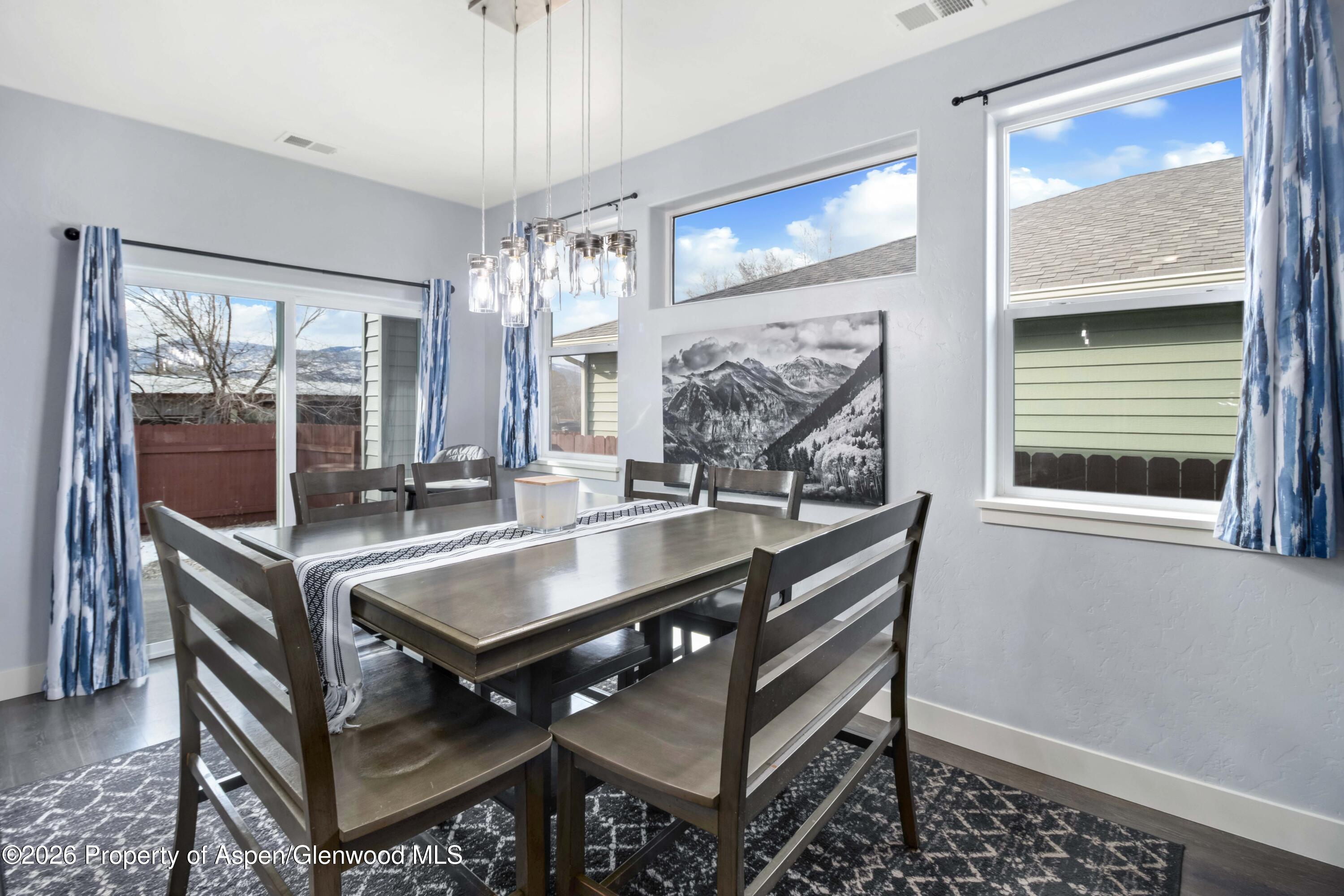 1671 East 17th Circle Rifle, CO 81650 - Photo 4 of 25 a dining room with furniture and window