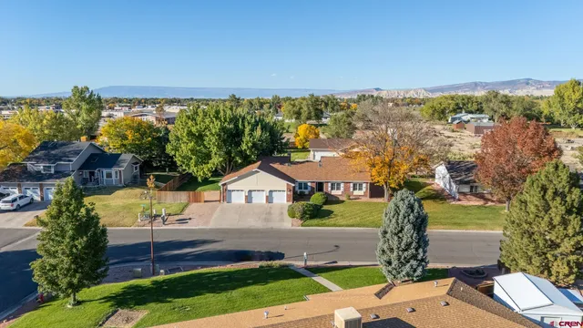 a view of yard with swimming pool and green space