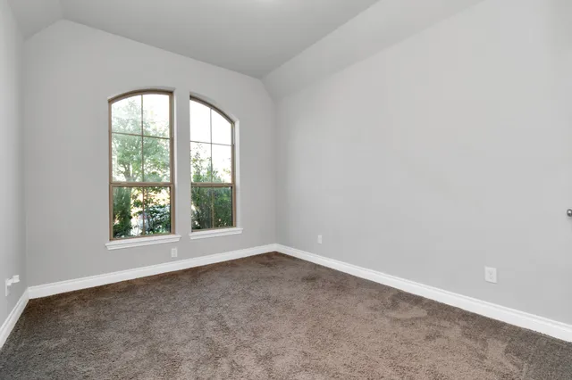 a bathroom with a toilet a sink a bathtub and a mirror