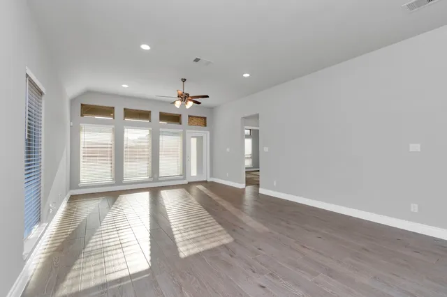 a kitchen with granite countertop kitchen island a sink and a stove