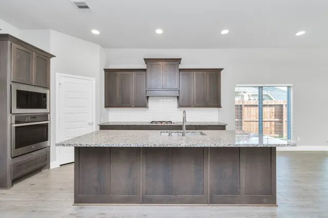 a view of a livingroom with wooden floor