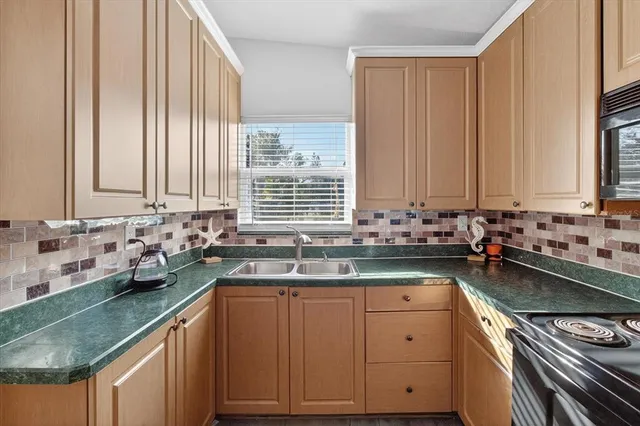 a kitchen with a sink and cabinets