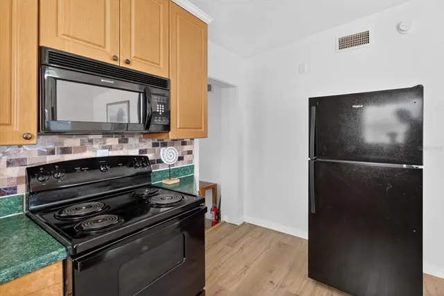 a kitchen with a stove and a microwave