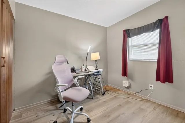 a workspace with furniture and wooden floor
