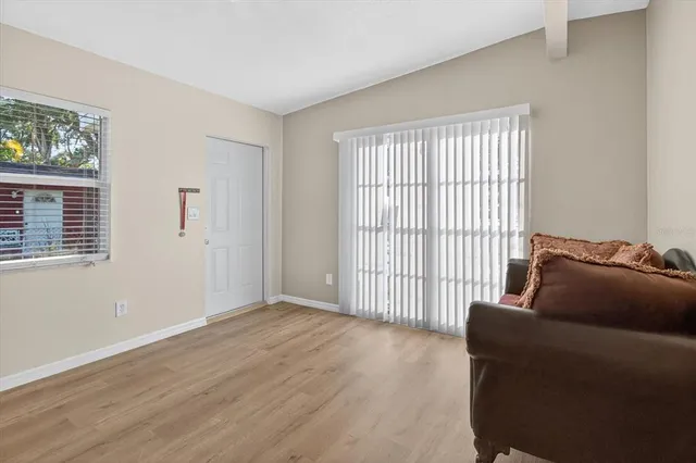 a living room with furniture and a window