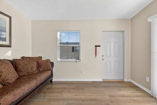 a living room with furniture and a window