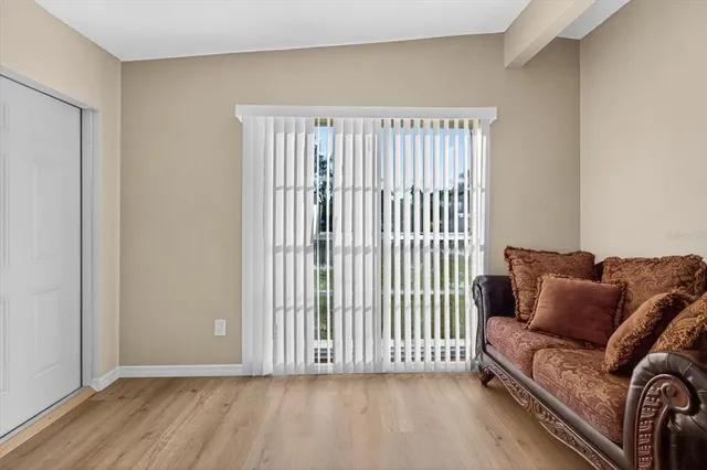 a living room with furniture and a window