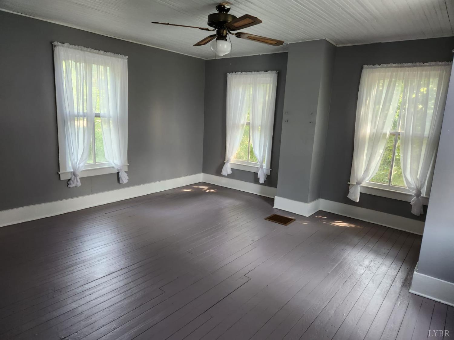 170 Taro Road Cullen, VA 23934 - Photo 15 of 22 an empty room with wooden floor and windows
