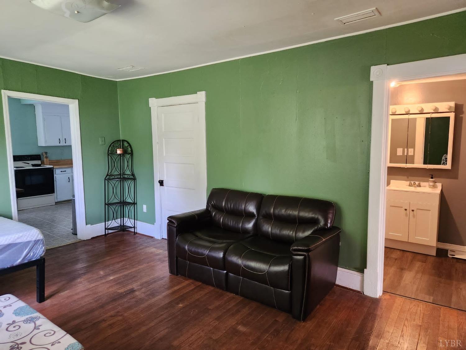 170 Taro Road Cullen, VA 23934 - Photo 8 of 22 a living room with furniture and a wooden floor