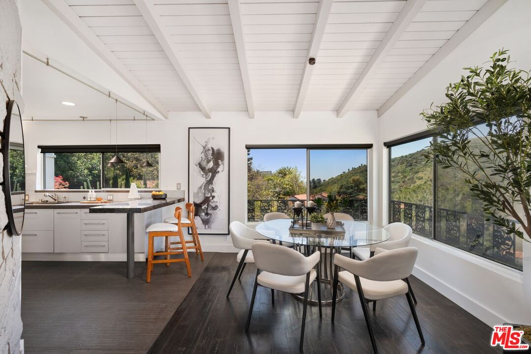 2221 Castilian Drive Los Angeles, CA 90068 - Photo 3 of 15 a view of a dining room with furniture window and outside view