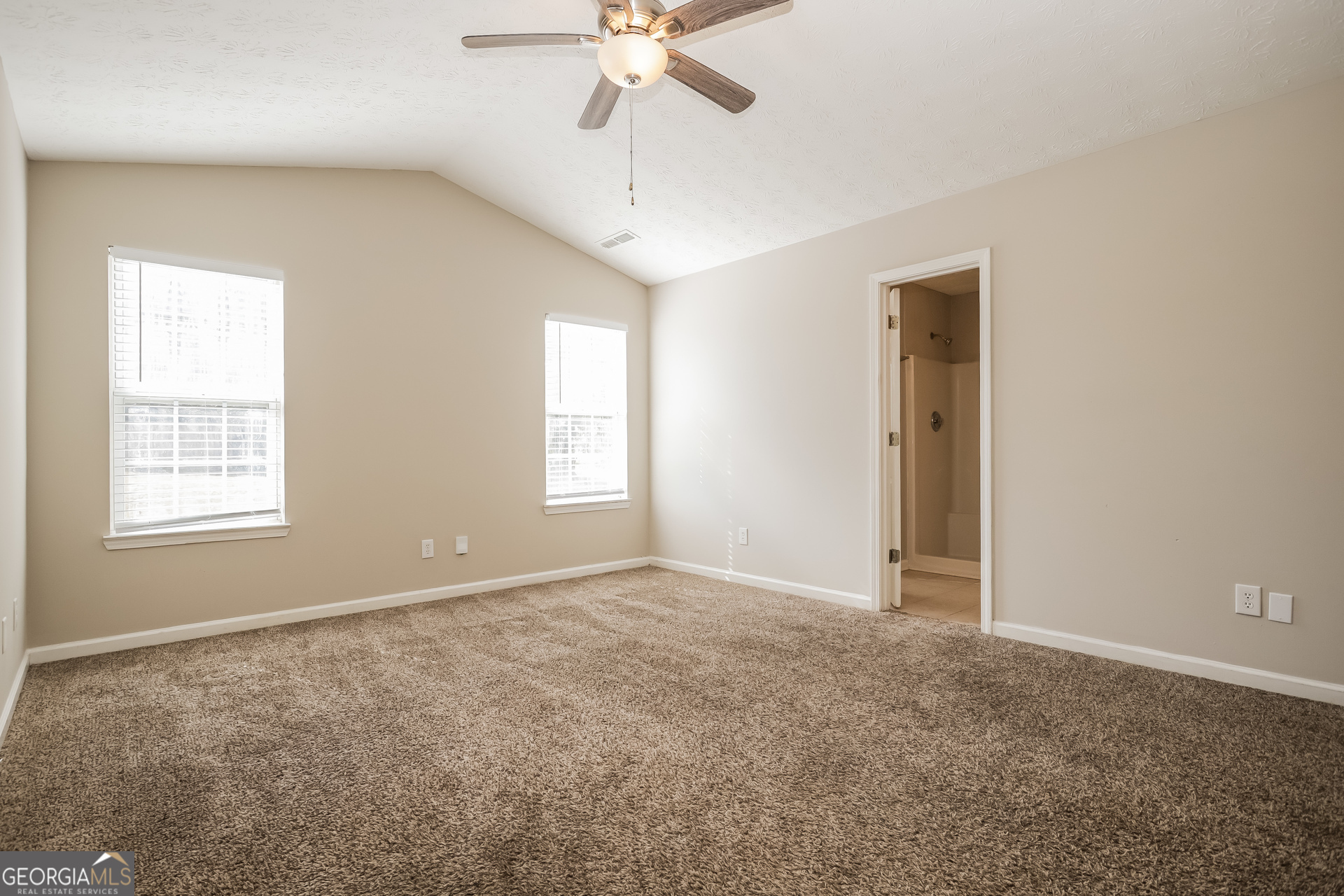 3006 Ryan Road Locust Grove, GA 30248 - Photo 11 of 21 a view of an empty room with a window