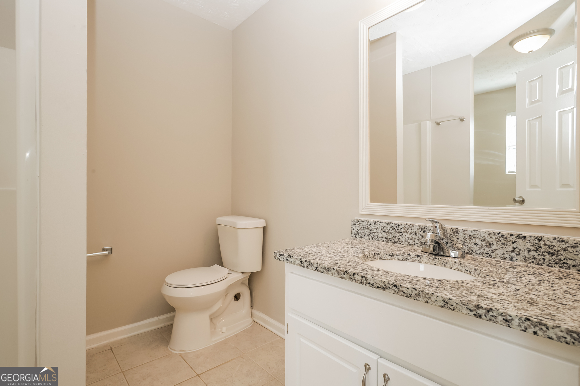 3006 Ryan Road Locust Grove, GA 30248 - Photo 12 of 21 a bathroom with a granite countertop sink and a mirror