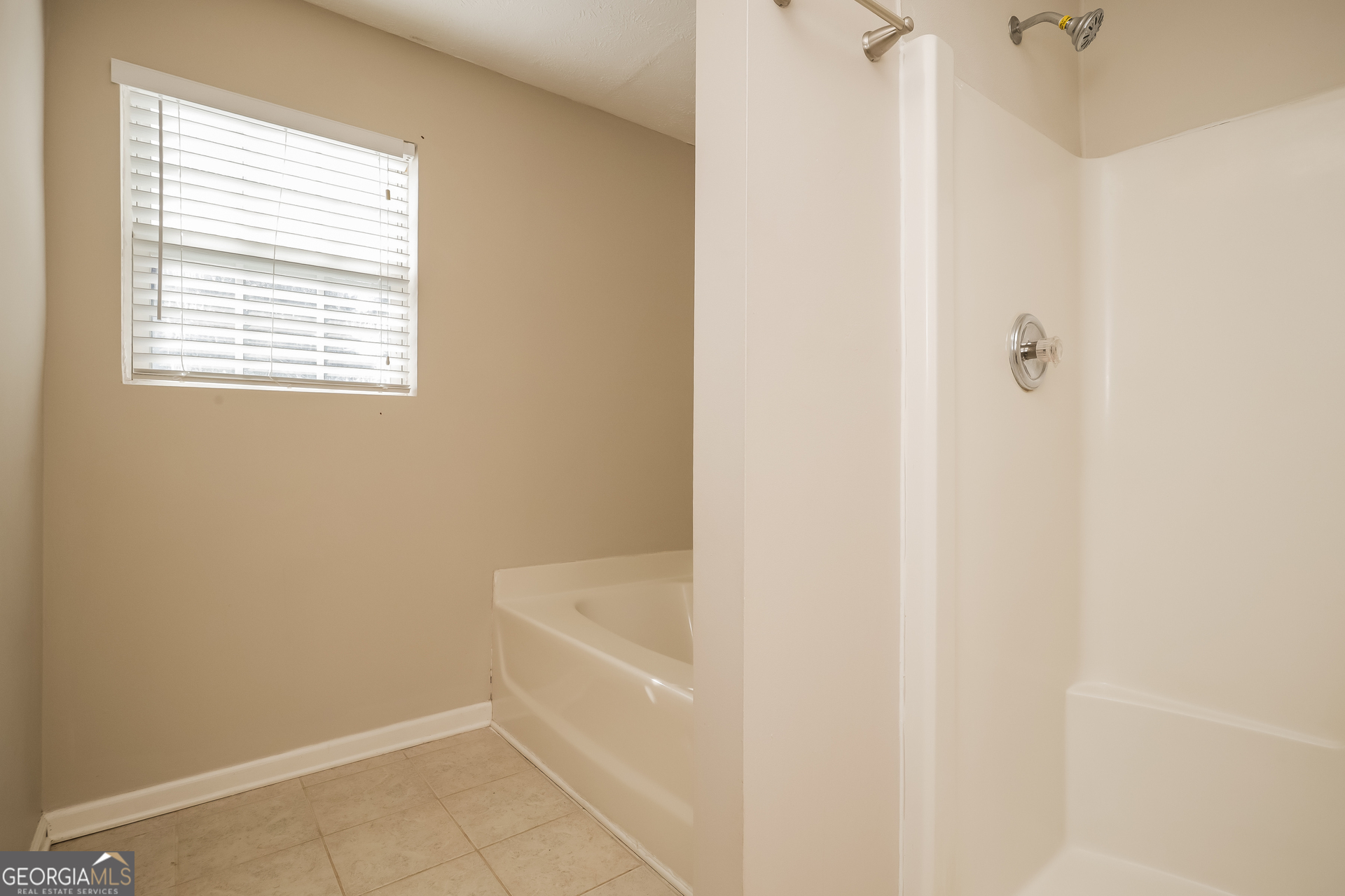 3006 Ryan Road Locust Grove, GA 30248 - Photo 13 of 21 a white bath tub sitting next to a white sink