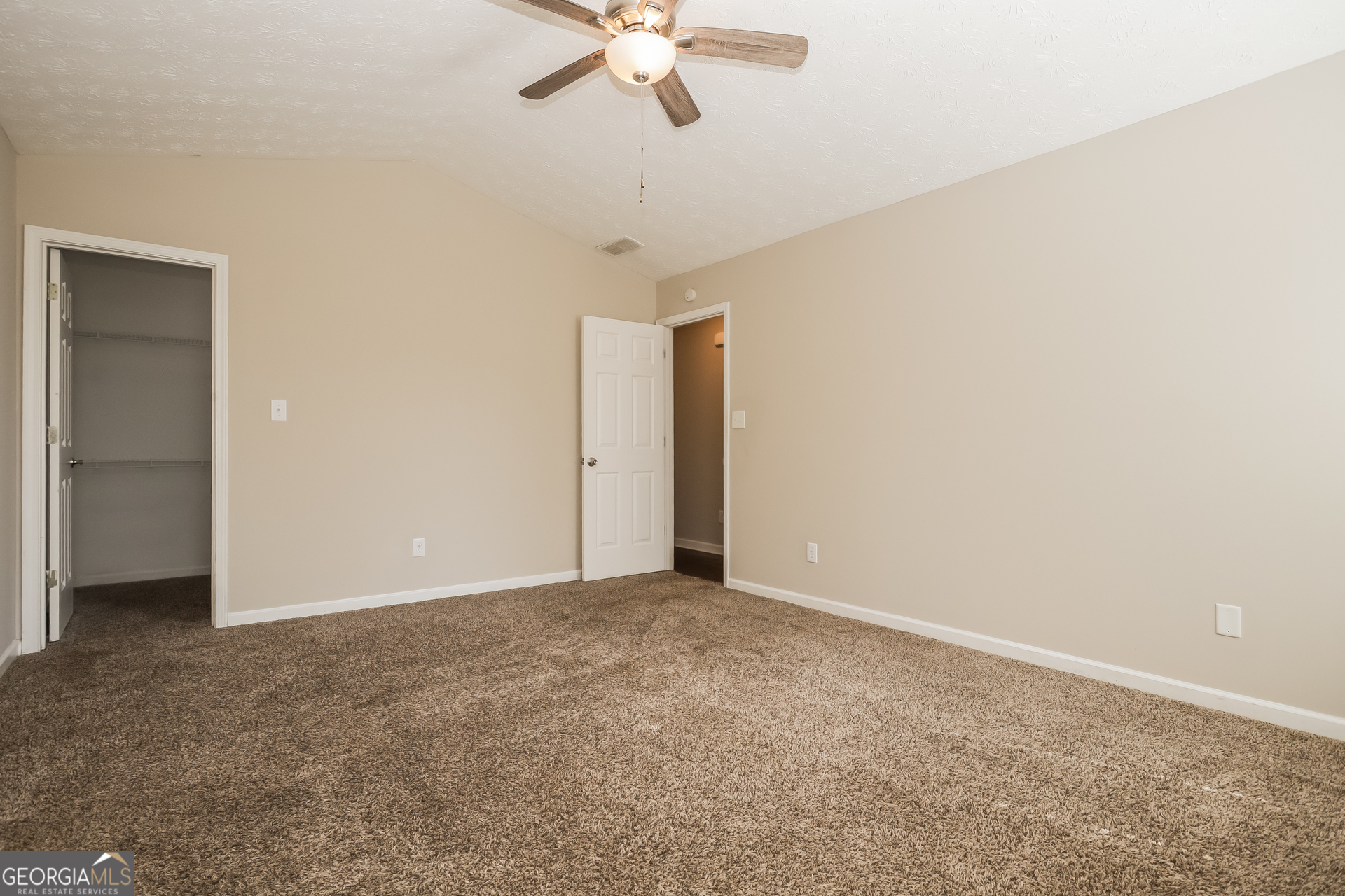 3006 Ryan Road Locust Grove, GA 30248 - Photo 16 of 21 a view of an empty room with a ceiling fan