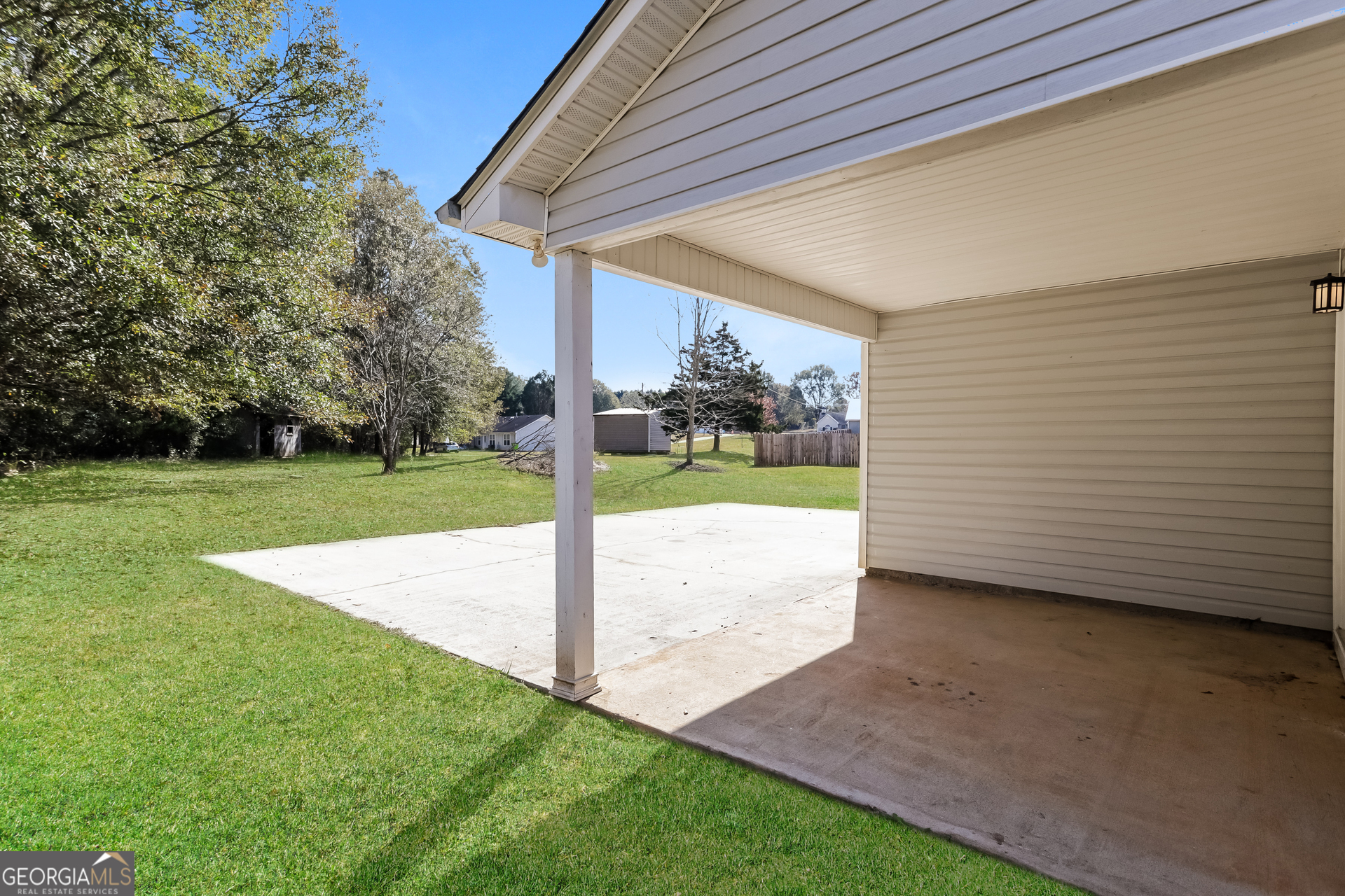 3006 Ryan Road Locust Grove, GA 30248 - Photo 20 of 21 a view of a house with backyard and porch