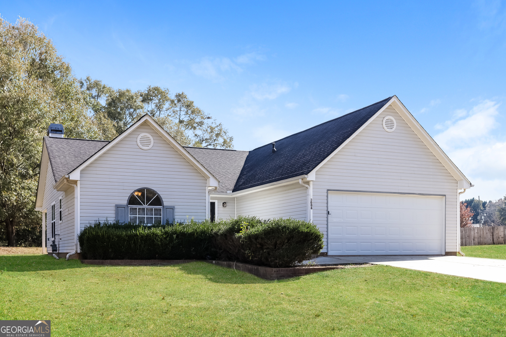 3006 Ryan Road Locust Grove, GA 30248 - Photo 2 of 21 a view of a house with a yard and garage