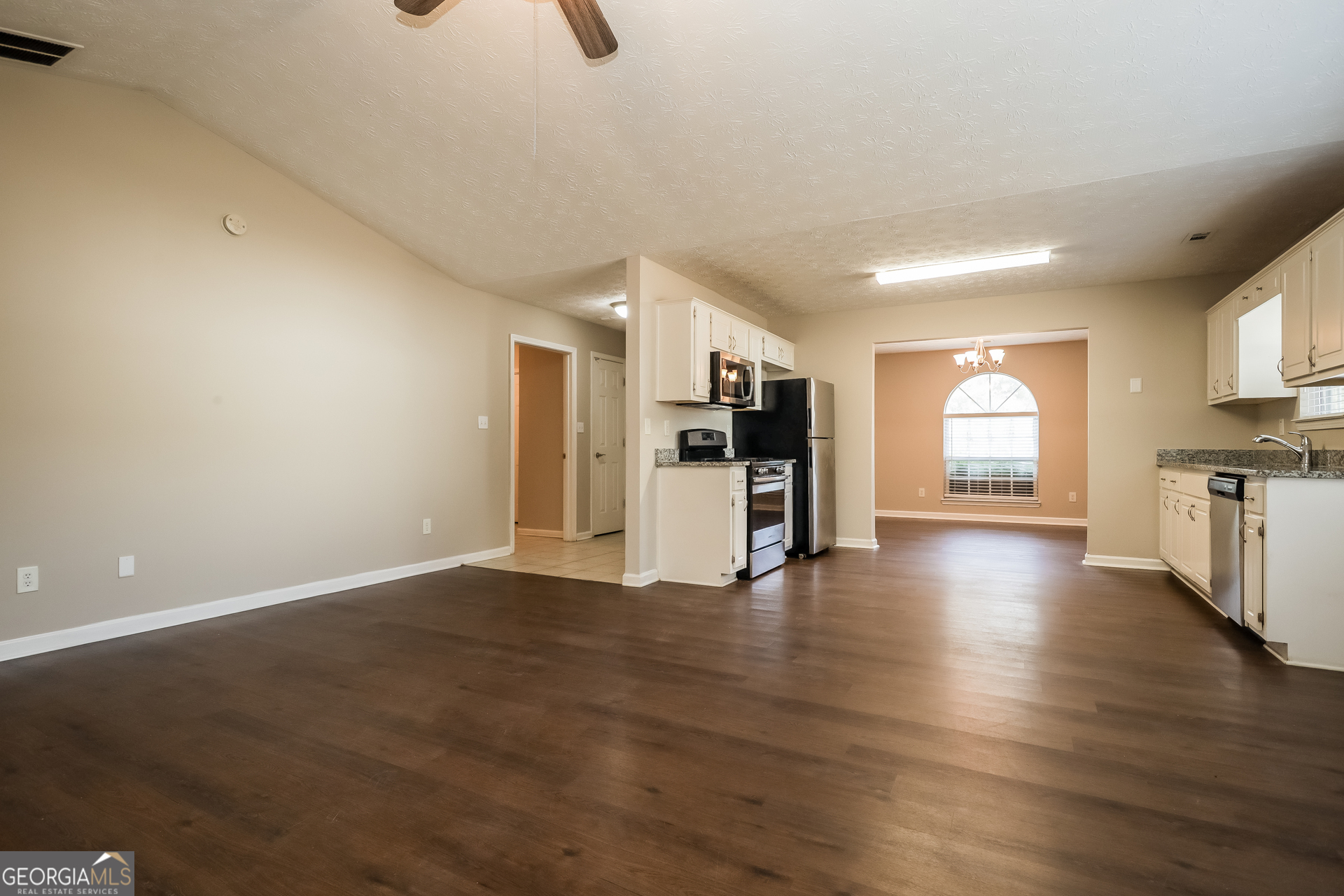 3006 Ryan Road Locust Grove, GA 30248 - Photo 5 of 21 a view of empty room with kitchen and window