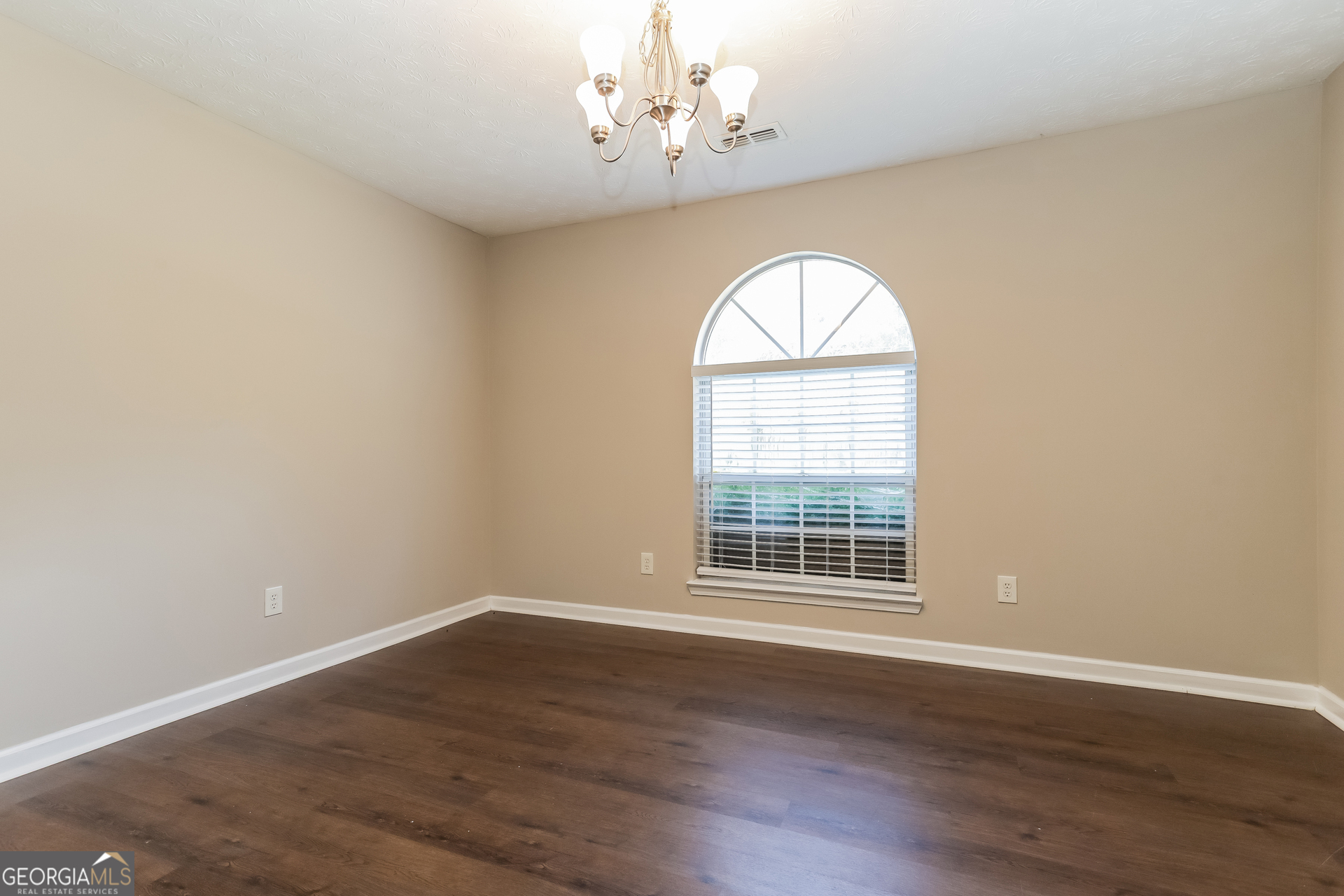 3006 Ryan Road Locust Grove, GA 30248 - Photo 6 of 21 wooden floor in an empty room with a window