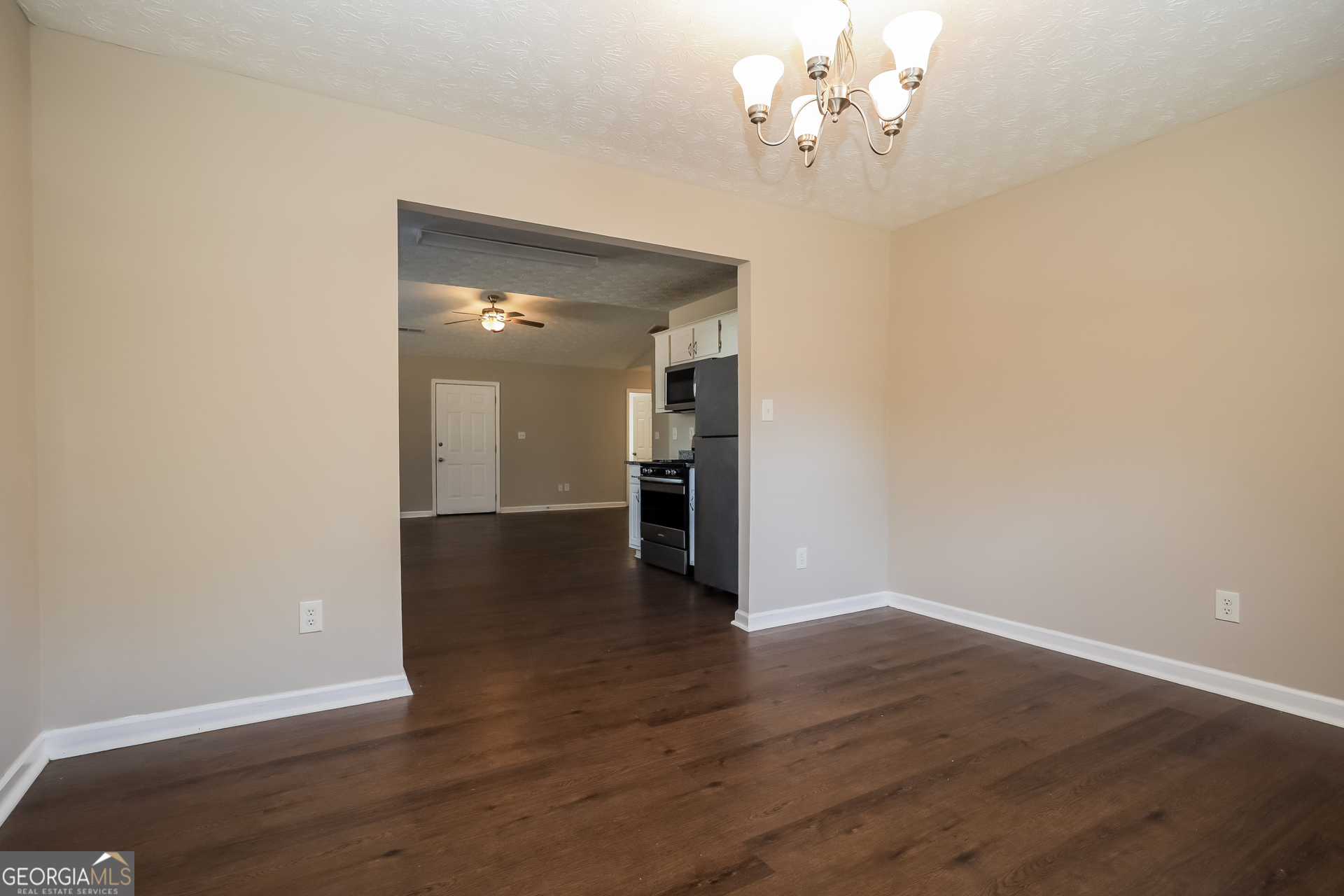 3006 Ryan Road Locust Grove, GA 30248 - Photo 7 of 21 a view of an empty room with wooden floor
