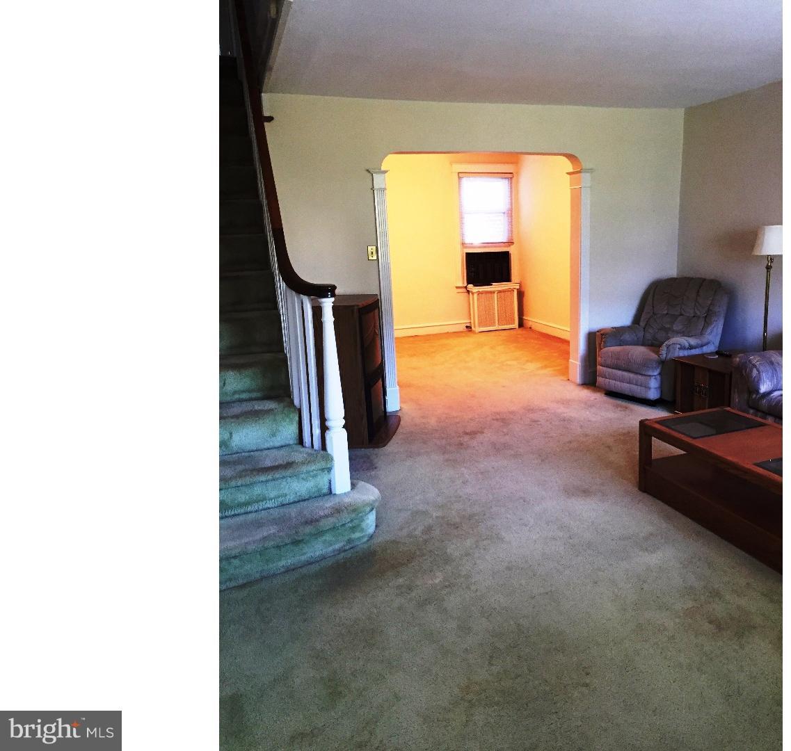 294 Sanford Road Upper Darby, PA 19082 - Photo 4 of 20 a living room with furniture and a fireplace