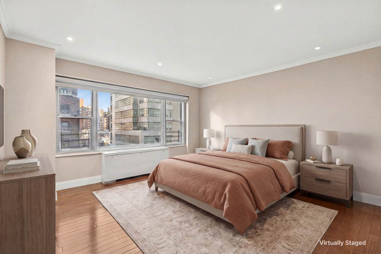 118 East 60th Street, Unit 8CD Manhattan, NY 10022 - Photo 4 of 10 a spacious bedroom with a bed and wooden floor
