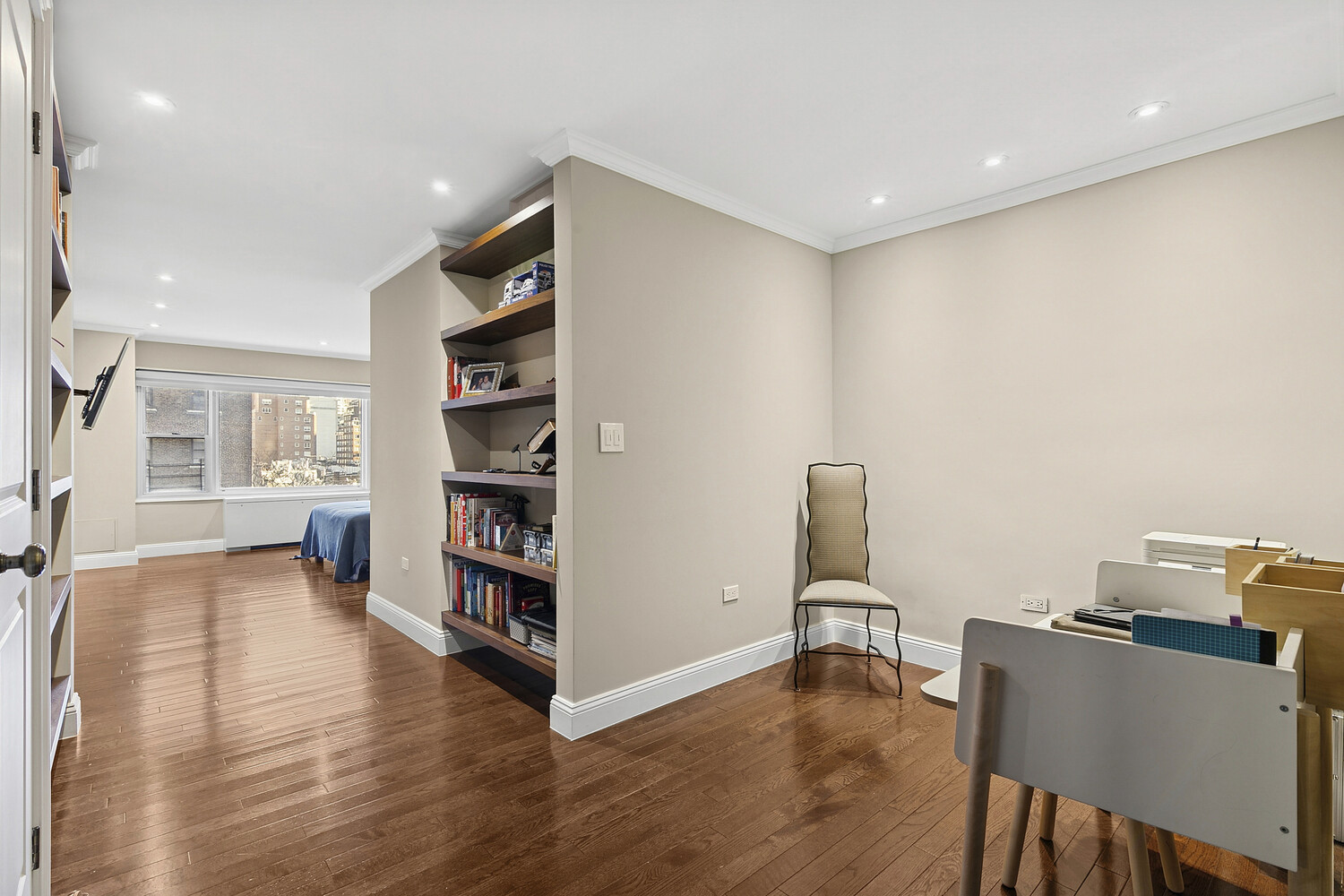 118 East 60th Street, Unit 8CD Manhattan, NY 10022 - Photo 6 of 10 a room with furniture and wooden floor