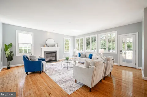 a spacious bathroom with a granite countertop sink and a mirror