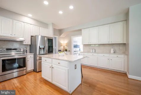 a view of empty room with wooden ceiling