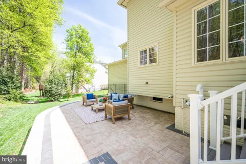 a living room with furniture a rug and a large window