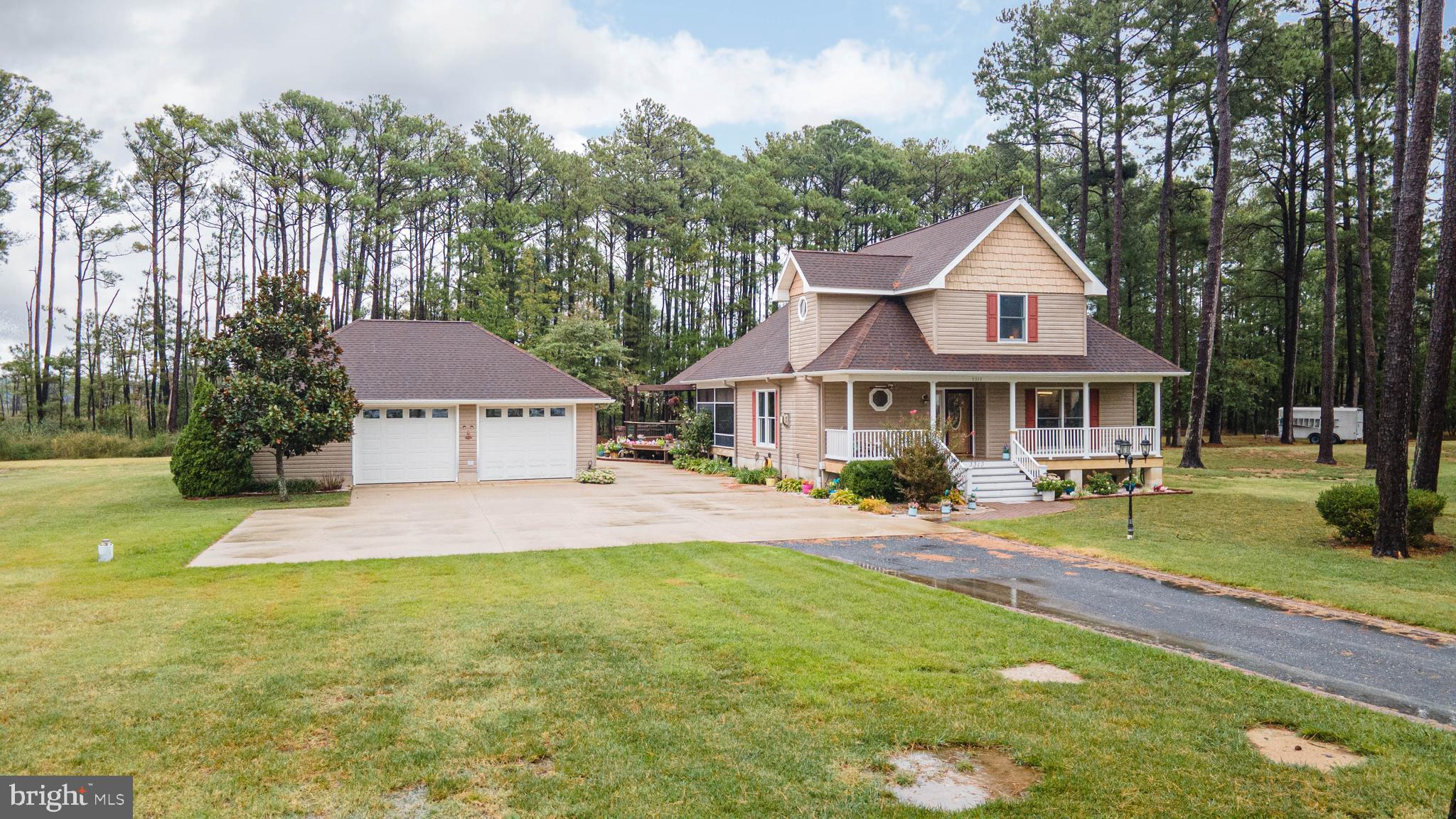 a front view of a house with swimming pool having outdoor seating