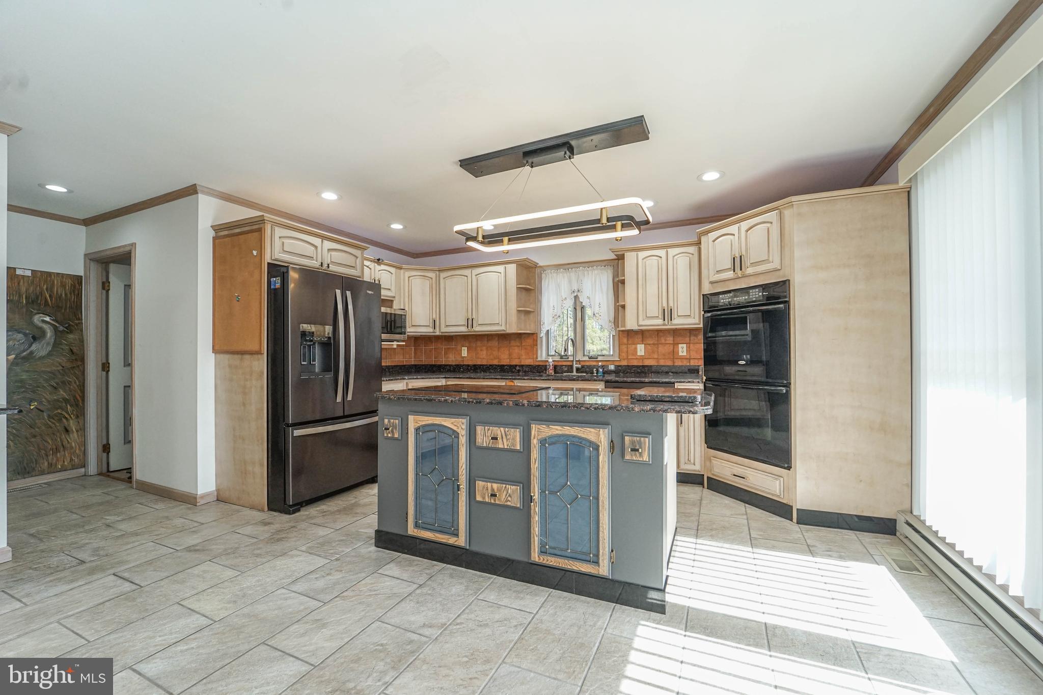 3313 Belfiore Road Church Creek, MD 21622 - Photo 44 of 70 a kitchen with stainless steel appliances granite countertop a refrigerator and a sink